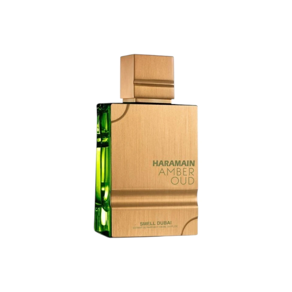 Botella dorada y verde metálica de Al Haramain Amber Oud Smell Dubai.