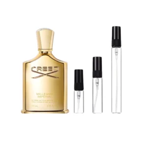 Decants Creed Millesime Imperial con botella dorada y viales de muestra.