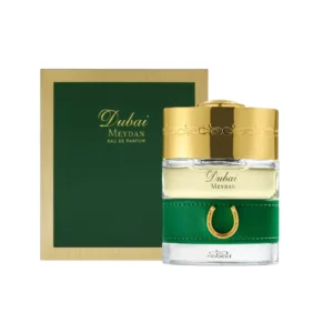 Caja verde con marco dorado y botella elegante del The Spirit of Dubai Meydan.