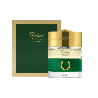 Caja verde con marco dorado y botella elegante del The Spirit of Dubai Meydan.